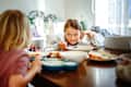 children eat together, and complete mess reigns on the table.