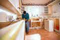 Man doing work renovating a vintage kitchen