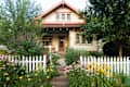 Bungalow House with White Picket Fence