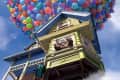 Elderly man looking out window of a house lifted by colorful balloons in the sky.