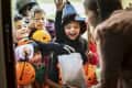 Little children trick or treating on Halloween