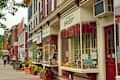 COOPERSTOWN, NY - SEPTEMBER 8, 2018: Shops, eateries, and baseball-themed attractions line the sidewalk on Main Street in this charming upstate New York town.