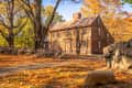 A historic colonial structure in Concord, MA on an October day