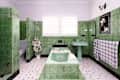 Killara, Sydney, Australia - Feb 12 2021: Green and white art deco tiled bathroom with bath in the center of the room