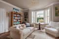 Cambridge, England - August 24 2018: Luxury traditional furnished victorian living room with modern furniture bay window