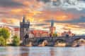 Prague - Charles bridge, Czech Republic. Scenic aerial sunset on the architecture of the Old Town Pier and Charles Bridge over the Vltava River in Prague, Czech Republic.