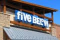 Five Below now open - Closeup of sign on building (Loveland, Colorado, USA)