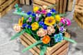 Prague, Czech Republic - April 22, 2024: Lego constructor plastic flowers The Botanical Collection in a wooden box.