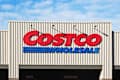 Hillsboro, OR, USA - Nov 17, 2021: Costco sign is seen at the entrance to its store in Hillsboro, Oregon. Costco Wholesale Corporation is an American multinational retail corporation.