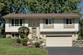 White, Split-level House With Lower Garage