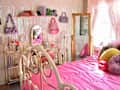 a bedroom with shades of pink, from hot pink to pale pink