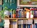 Bookshelf overflowing with books.