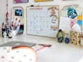 Various art and objects on white desk