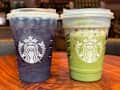 Two Starbucks drinks on a wooden table: a purple iced beverage and a green iced matcha drink, both in clear cups.