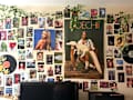 Wall covered with various posters and photos, including a large DoeChii poster, a TV, and a water filter pitcher.