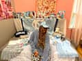 College student in decorated dorm room.