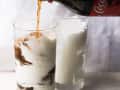 Fluffy coke beverage being made.