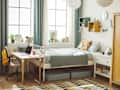 dorm room with bed, big windows, desk, hanging paper lanterns, closet
