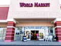 Charlottesville, USA - May 8, 2021: World Market store in Albemarle county, Virginia with sign at entrance and people for now hiring apply now during the jobs pandemic