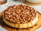 Luscious, creamy cheesecake with a caramel pecan pie topping