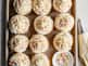 cupcakes line up on sheet pan