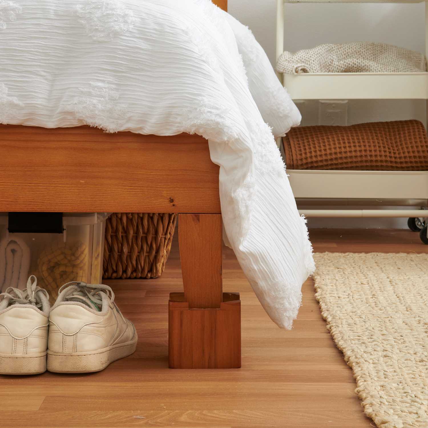 https://cdn.apartmenttherapy.info/image/upload/f_jpg%2Cq_auto%3Aeco%2Cc_fill%2Cg_auto%2Cw_1500%2Car_1%3A1/at%2Forganize-clean%2F2023%2FStock%2FCustom%20Stock%20Shoots%2F2023-06-bed-risers%2Fbed-risers-440