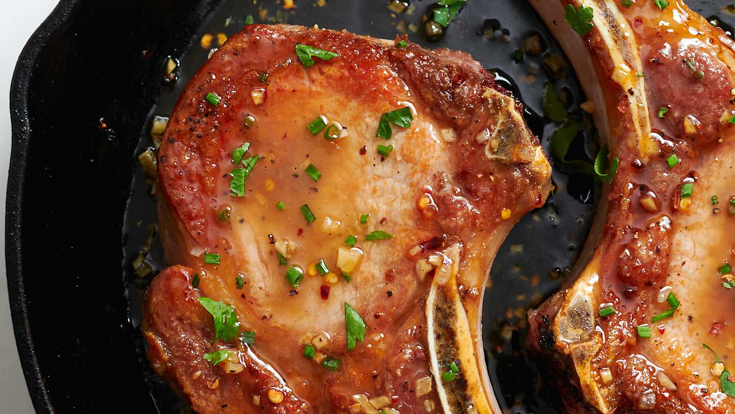 Golden pork chops coated with honey garlic sauce