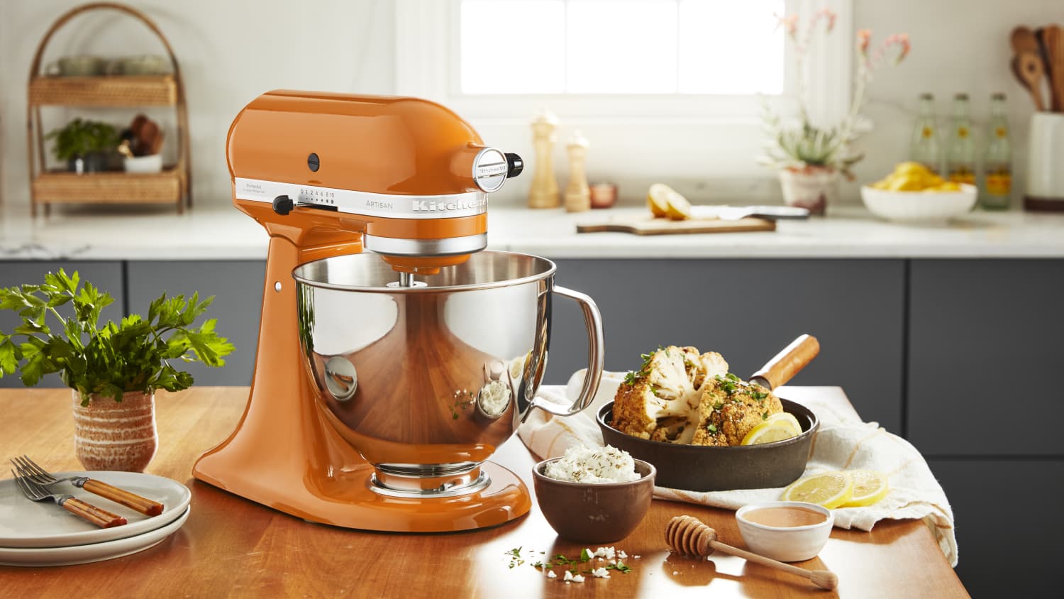 https://cdn.apartmenttherapy.info/image/upload/f_jpg,q_auto:eco,c_fill,g_auto,w_1500,ar_16:9/KitchenAid_Stand_Mixer_Honey_Lifestyle_2