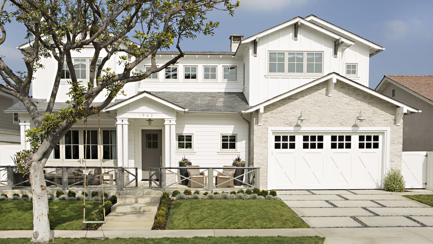 A finished home exterior with new roof and siding