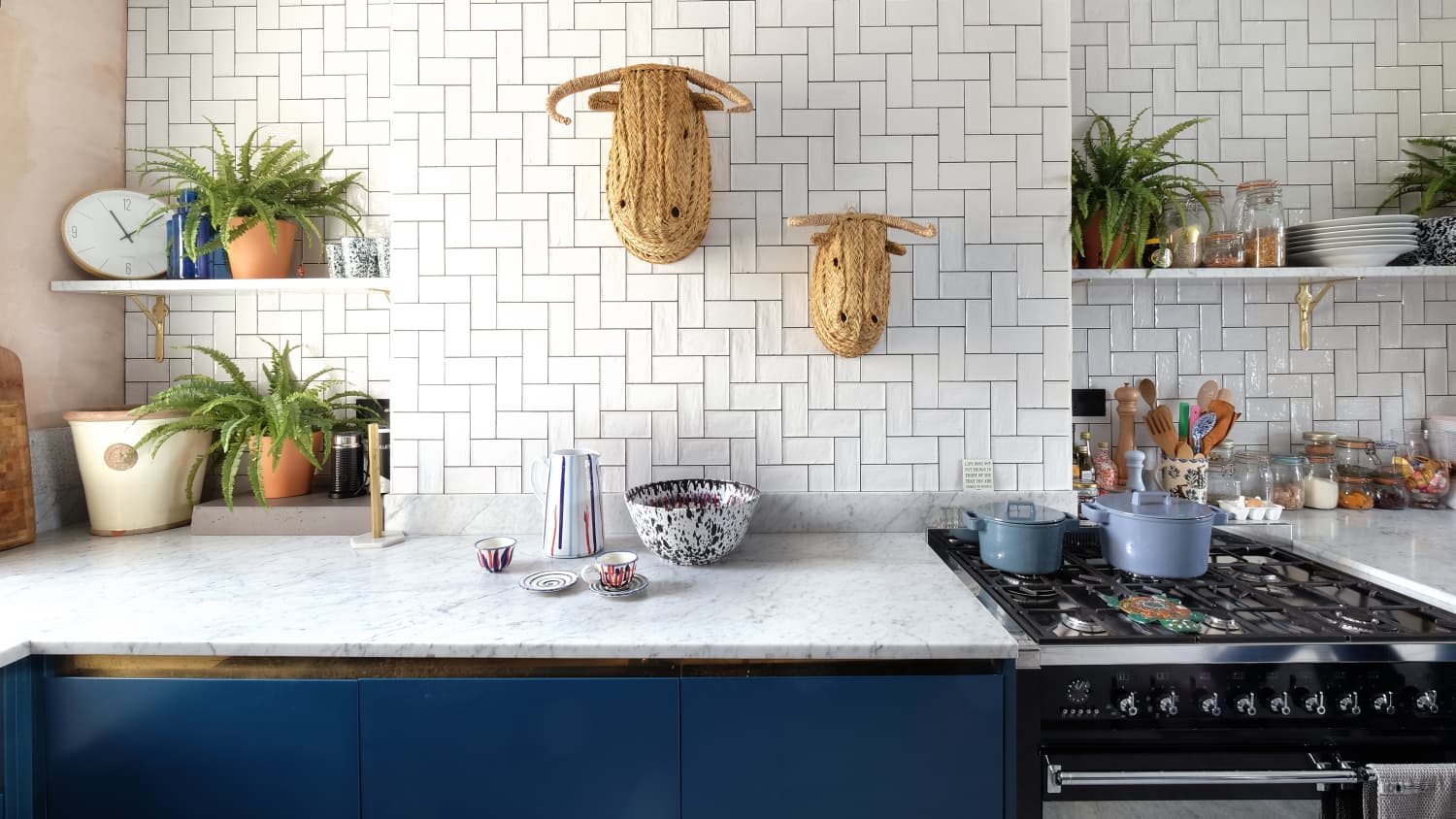 white kitchen with blue subway tile backsplash