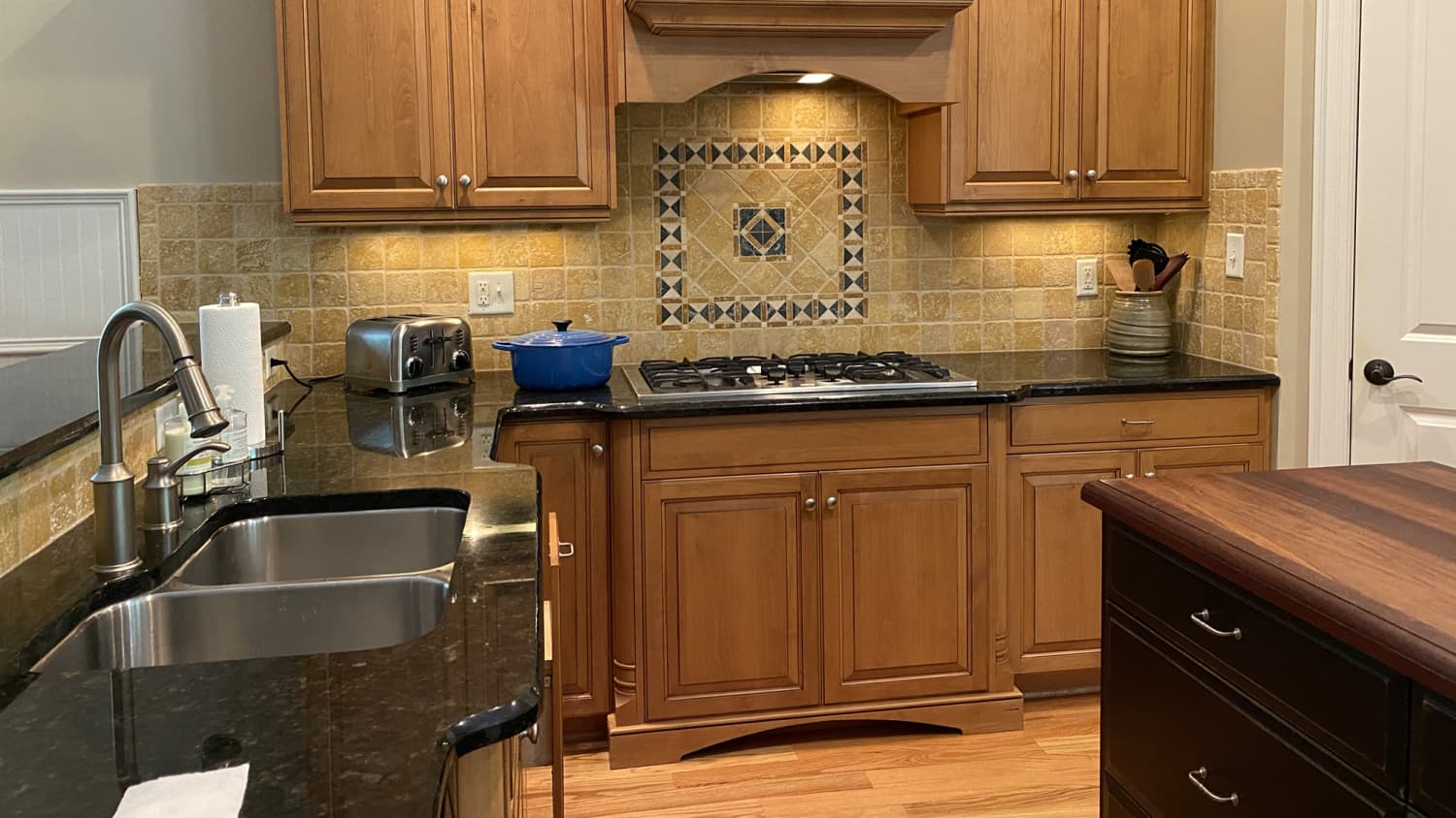 Black countertops hotsell with wood cabinets