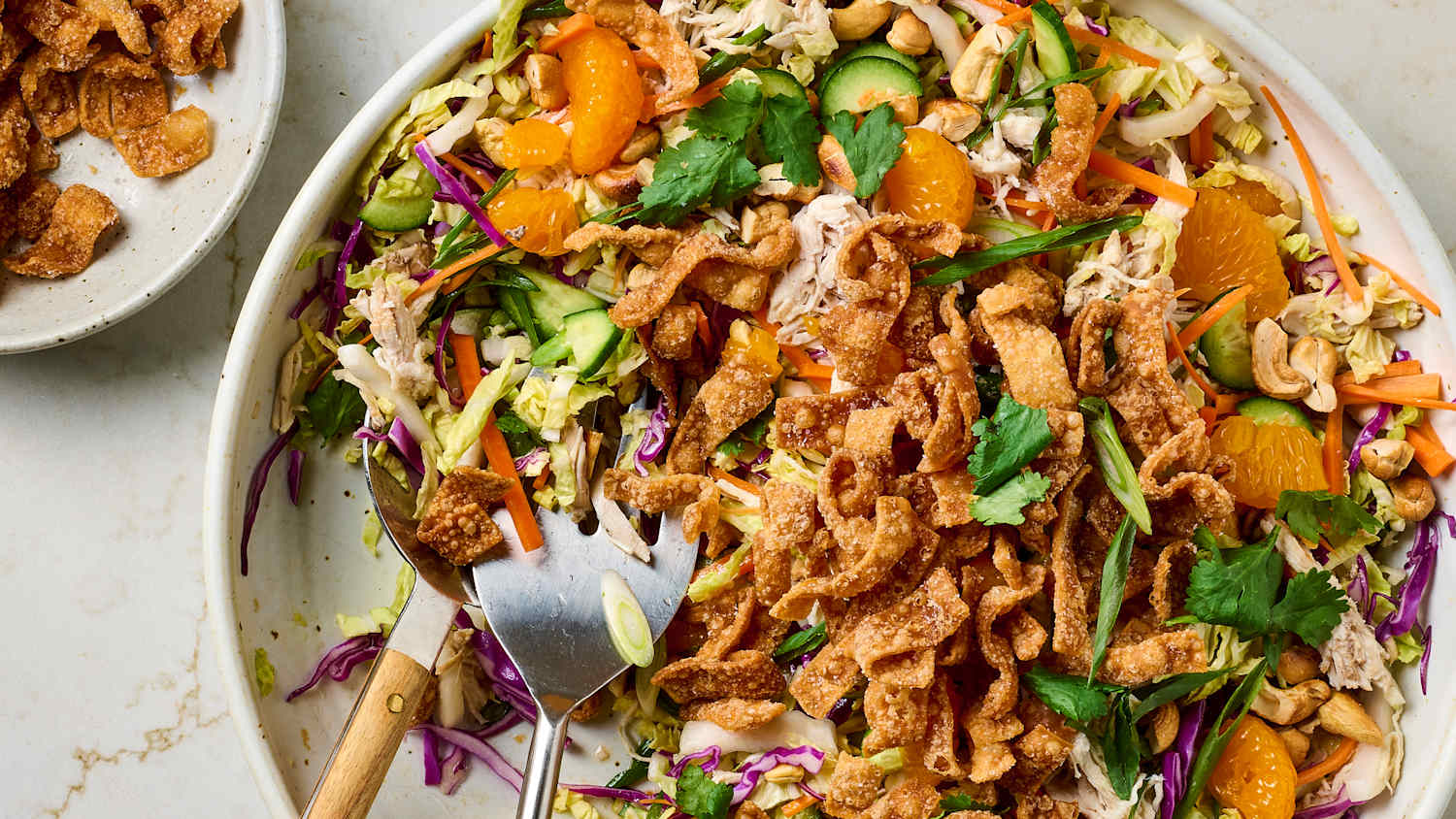 Asian sesame chicken salad with cabbage and oranges