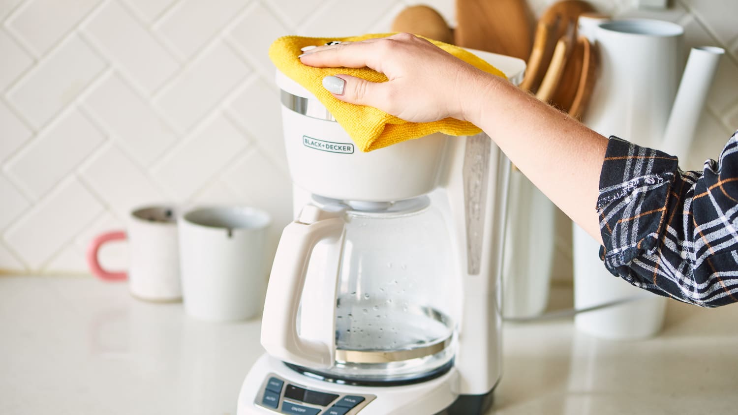 Cleaning drip coffee outlet maker with vinegar