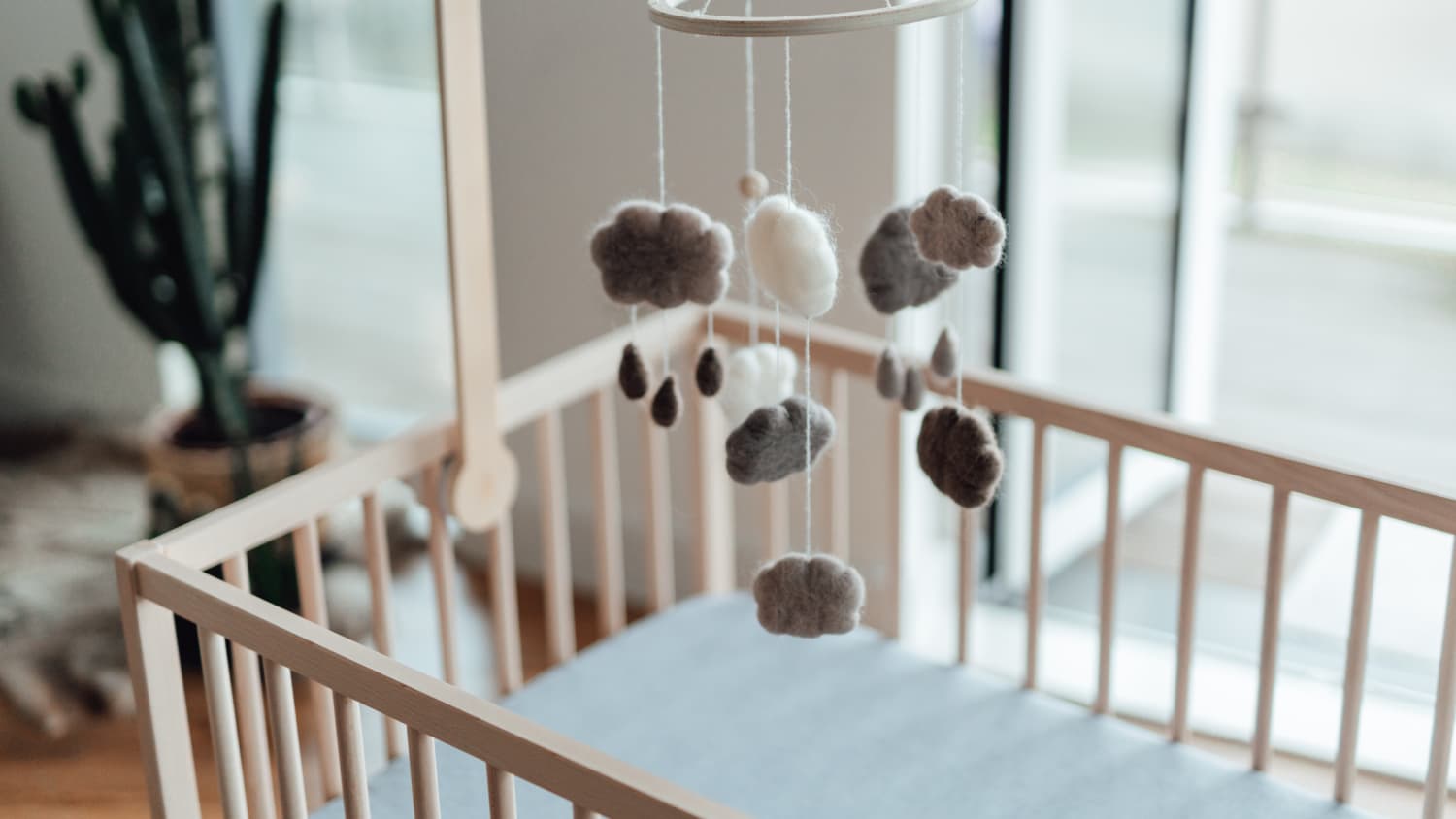 How I Made Zero Holes Hanging a Nursery Mobile from the Ceiling of