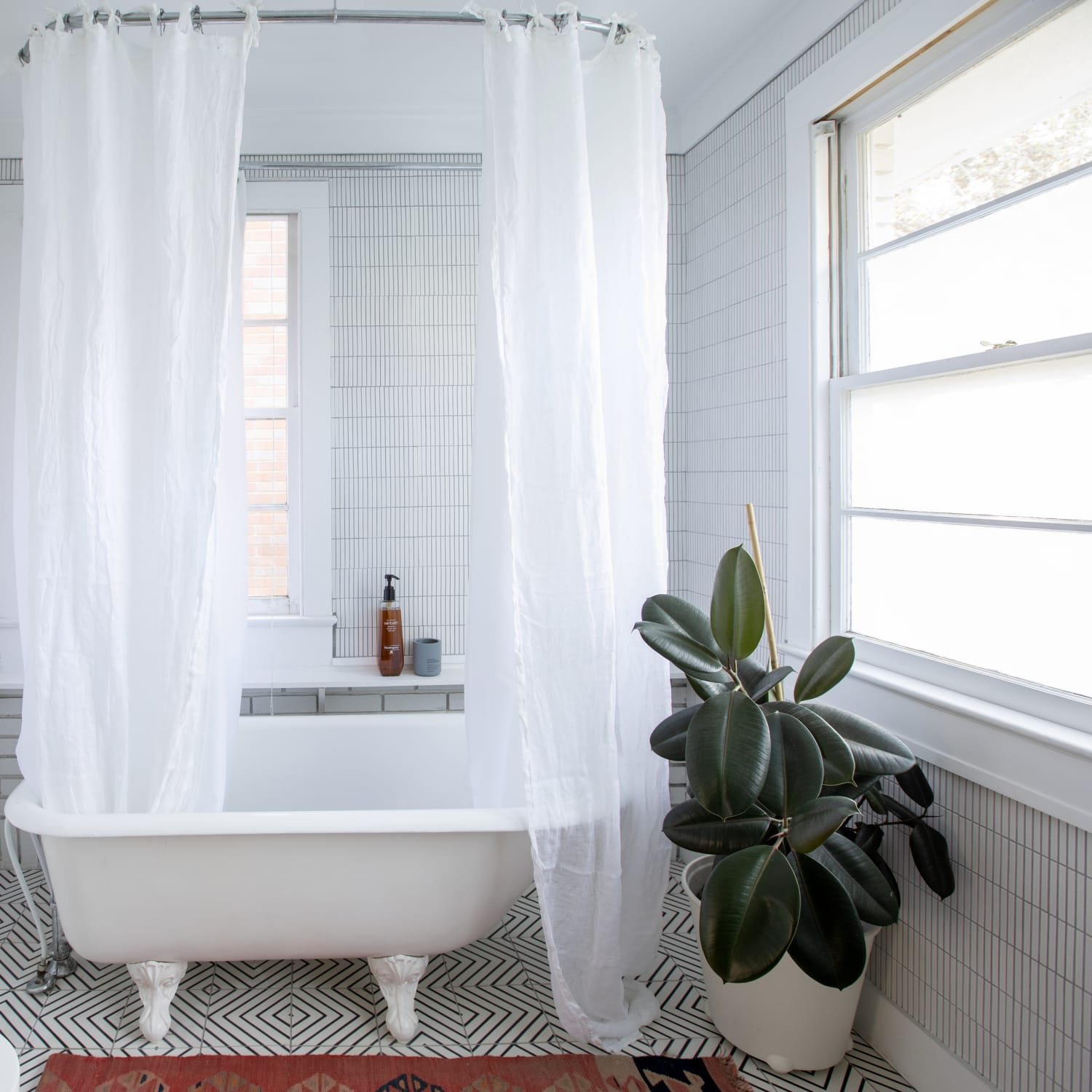 Elizabeth Partida Realtor - Small bathroom? Hang your curtain high! Cloth shower  curtains introduce a level of sophistication and glamour to any bathroom.  Use this to your advantage in a small space