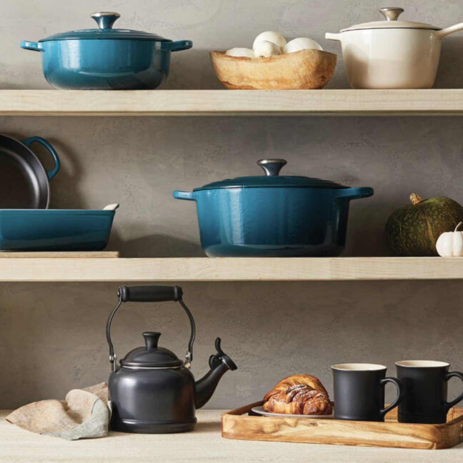 https://cdn.apartmenttherapy.info/image/upload/f_jpg,q_auto:eco,c_fill,g_auto,w_1500,ar_1:1/at%2Fle-creuset-as-decor