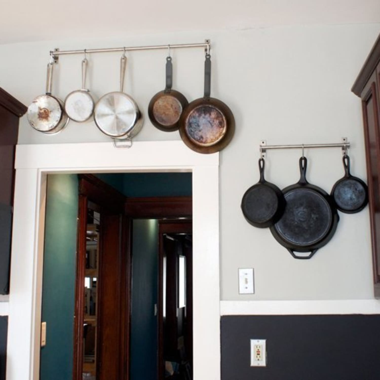 Hanging pots and clearance pans on wall