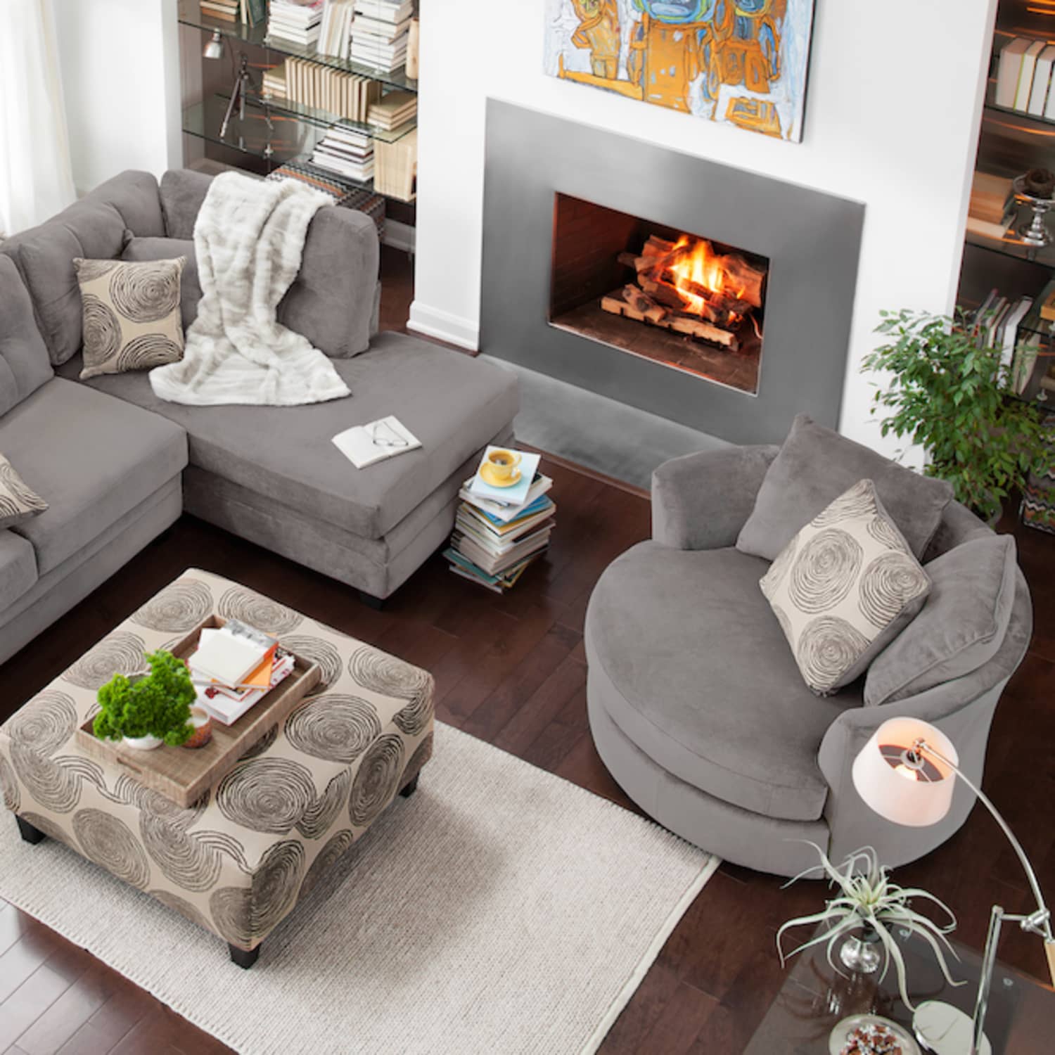 L shaped couch in deals front of fireplace