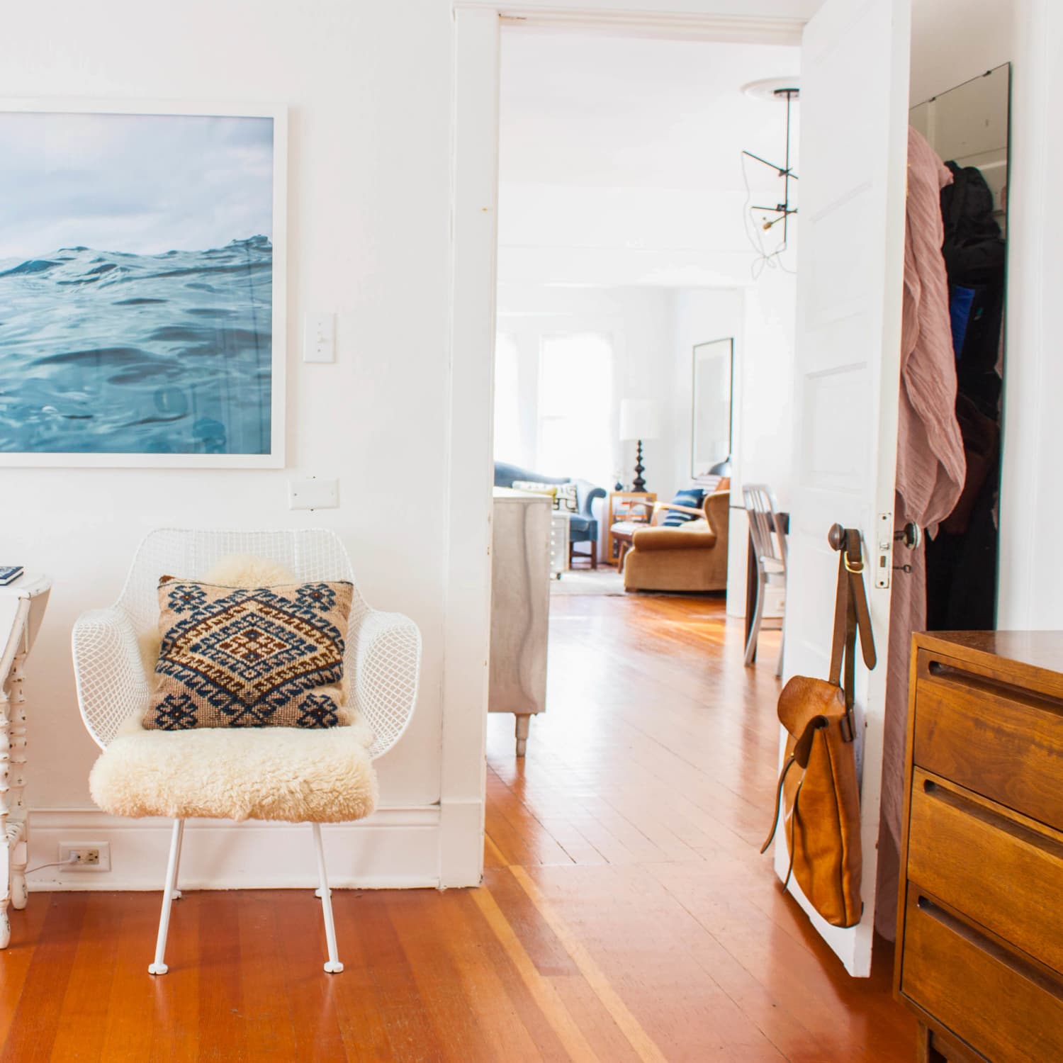 Hanging pictures on a long deals wall