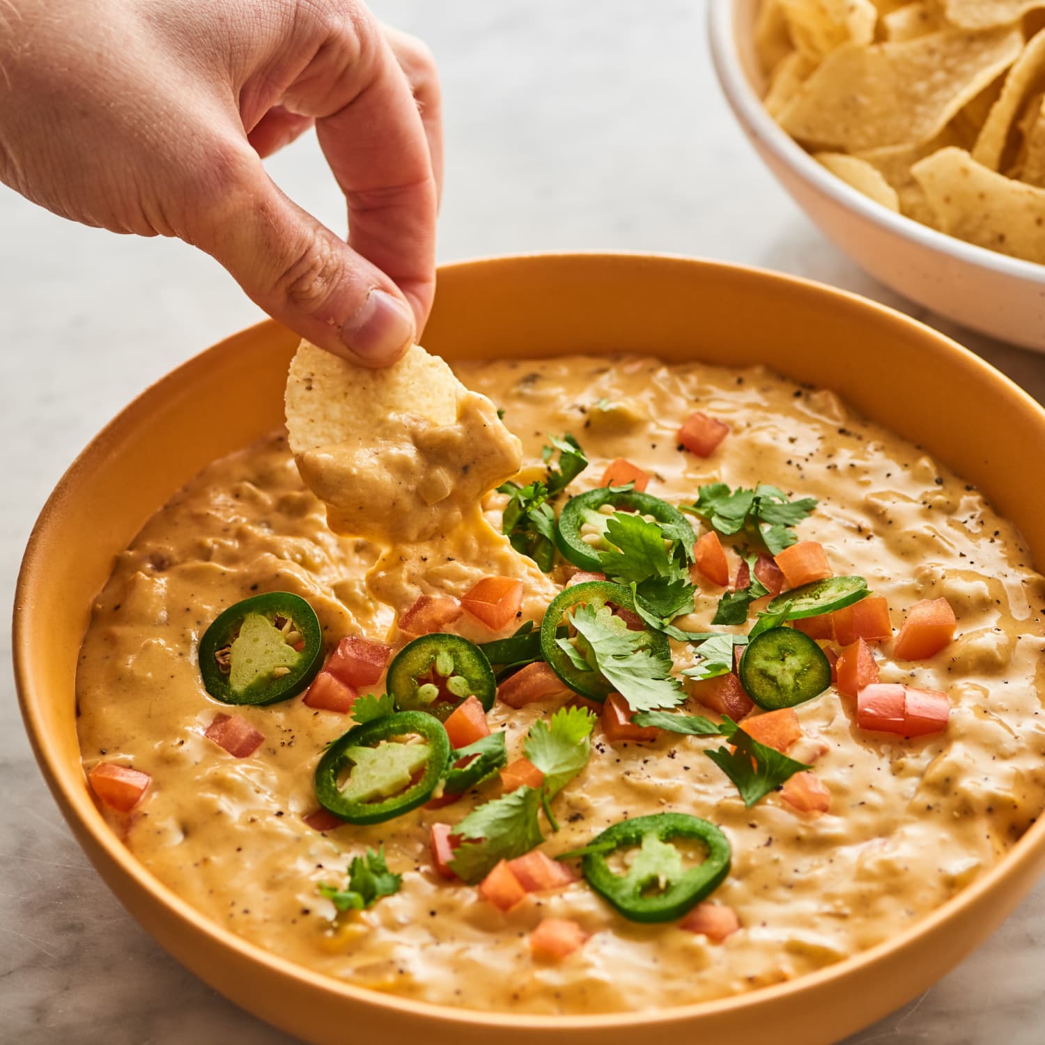Easy Queso Dip Recipe Kitchn Serve with tortilla chips and extra chorizo and cilantro on top. easy queso dip