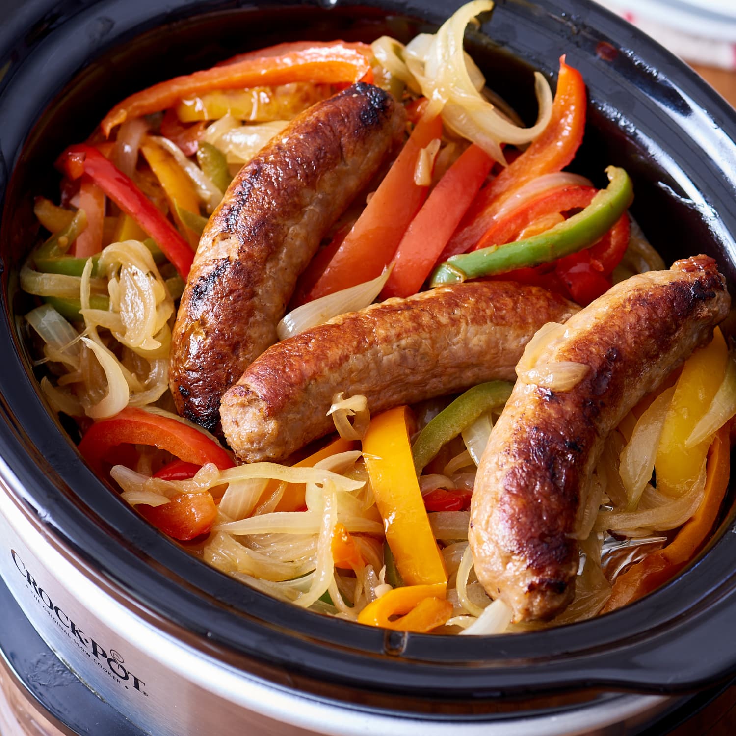 Slow Cooker Brats with Onions and Peppers - Cooking With Carlee