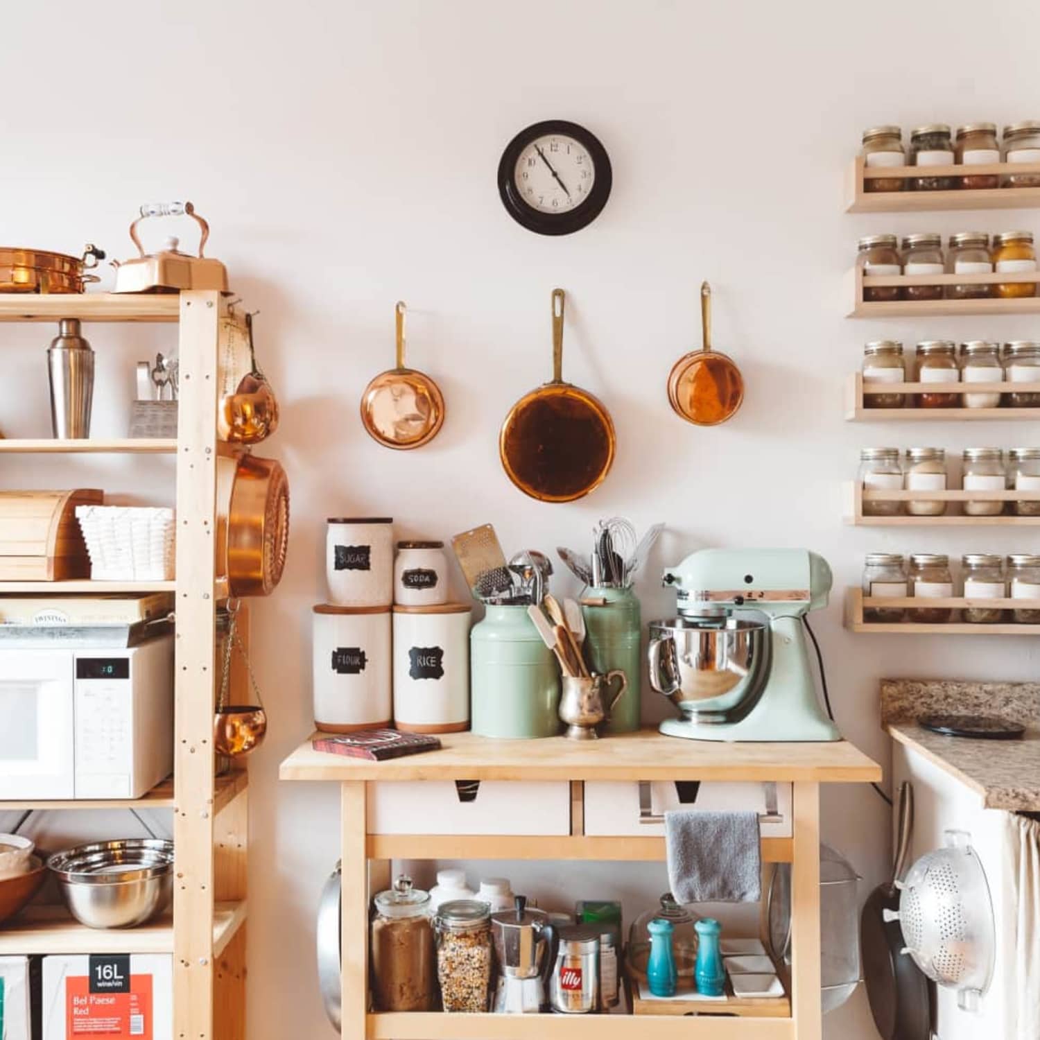 An island adds extra kitchen counter space to an L-shaped kitchen