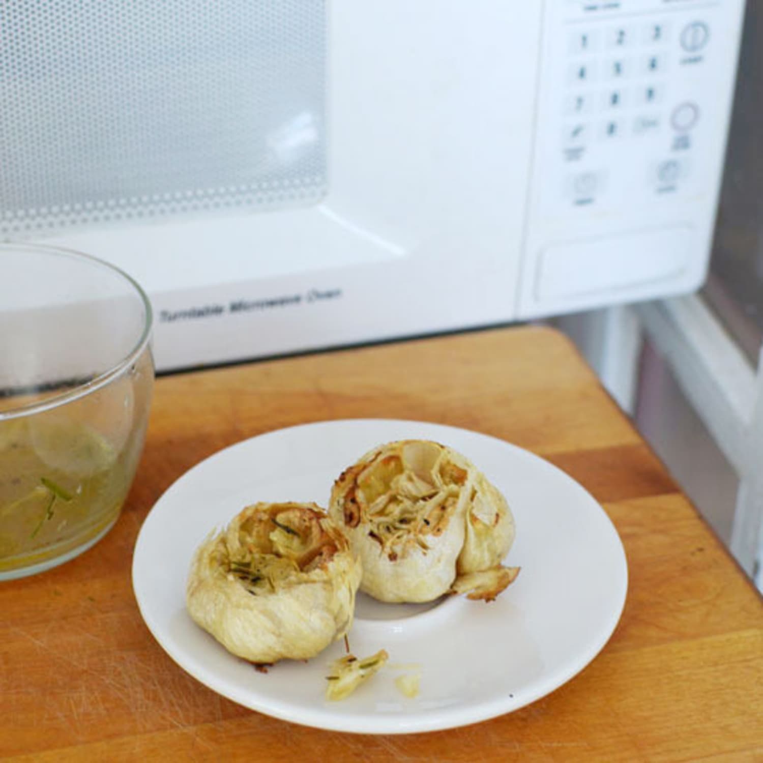 How To Roast Garlic In The Microwave Kitchn If you know yours is higher (for example 1300 watts), you can change to cooking times to get the same results. how to roast garlic in the microwave