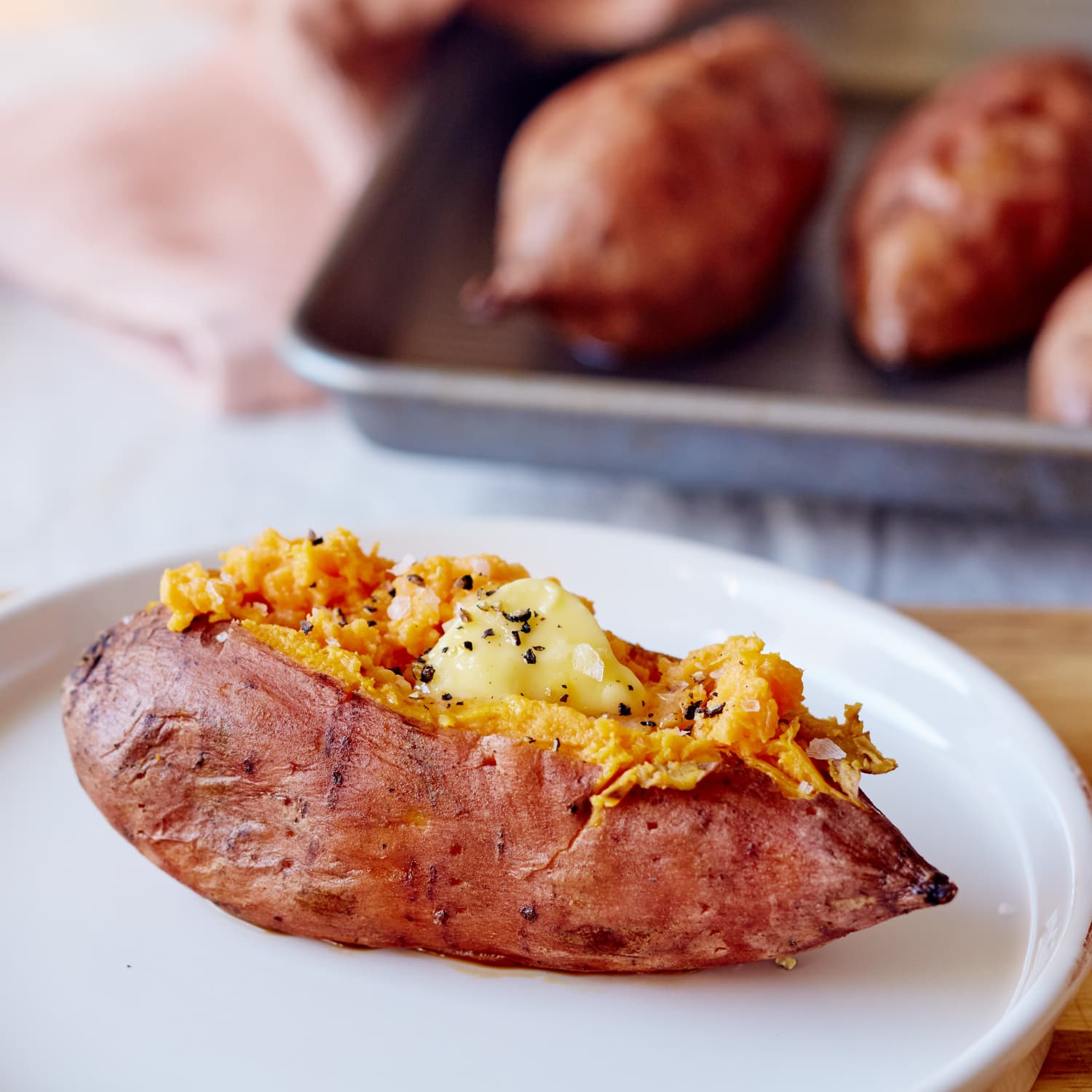 Easy Baked Sweet Potato Recipe Kitchn Next, cover the bake dish with foil, then bake the yams in the oven for 30 minutes. how to bake a sweet potato in the oven