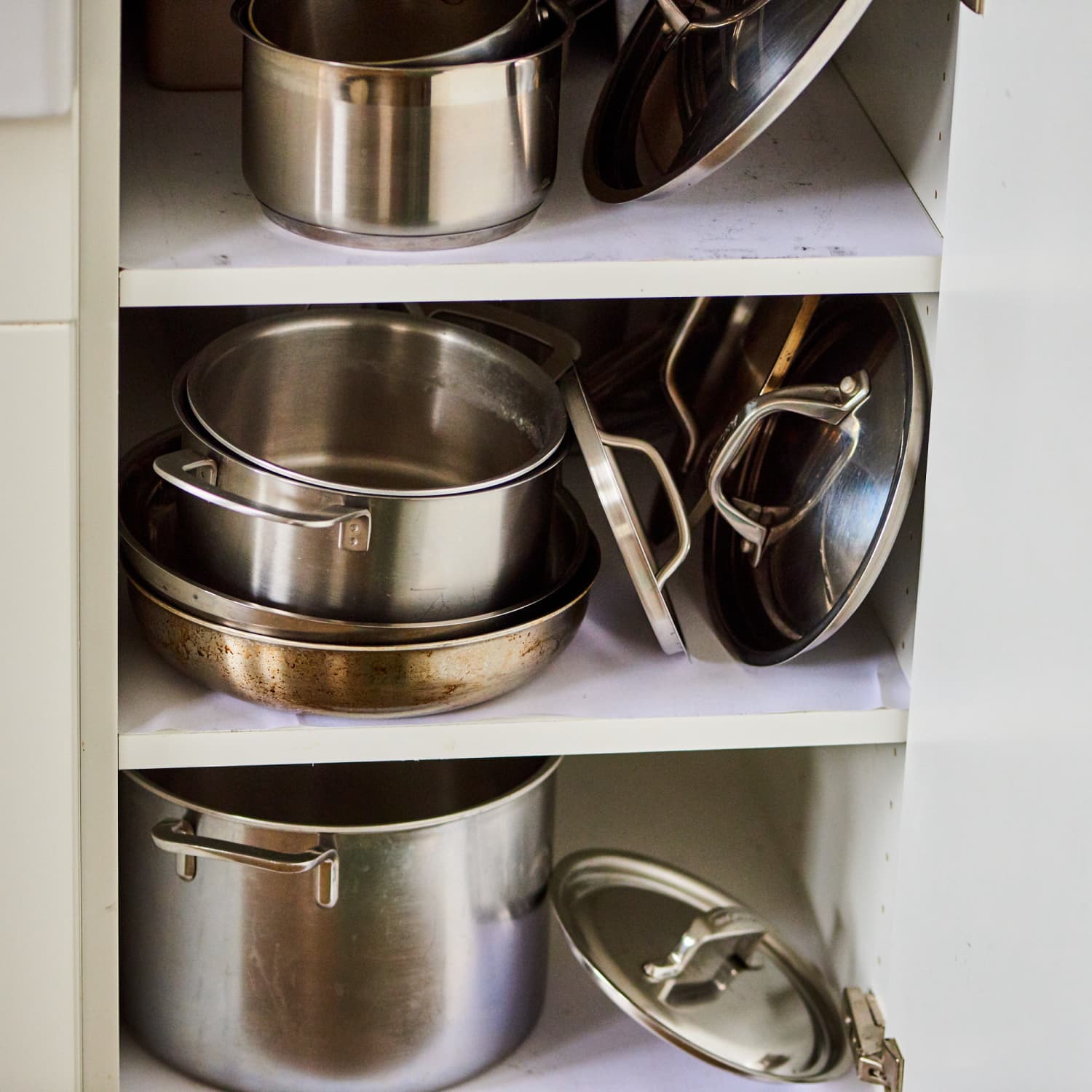 Storing pot lids with command hooks outlet