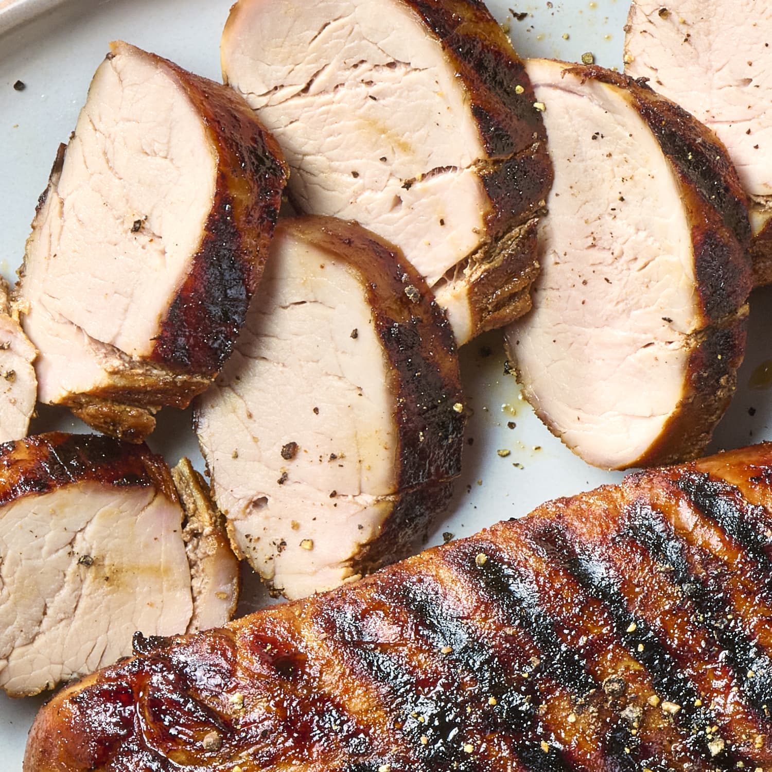 Pork tenderloin on charcoal grill top