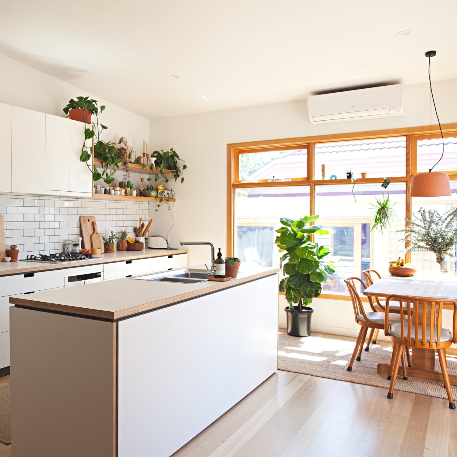 Bold, Small Kitchen with Green Cabinets and Slate Appliances