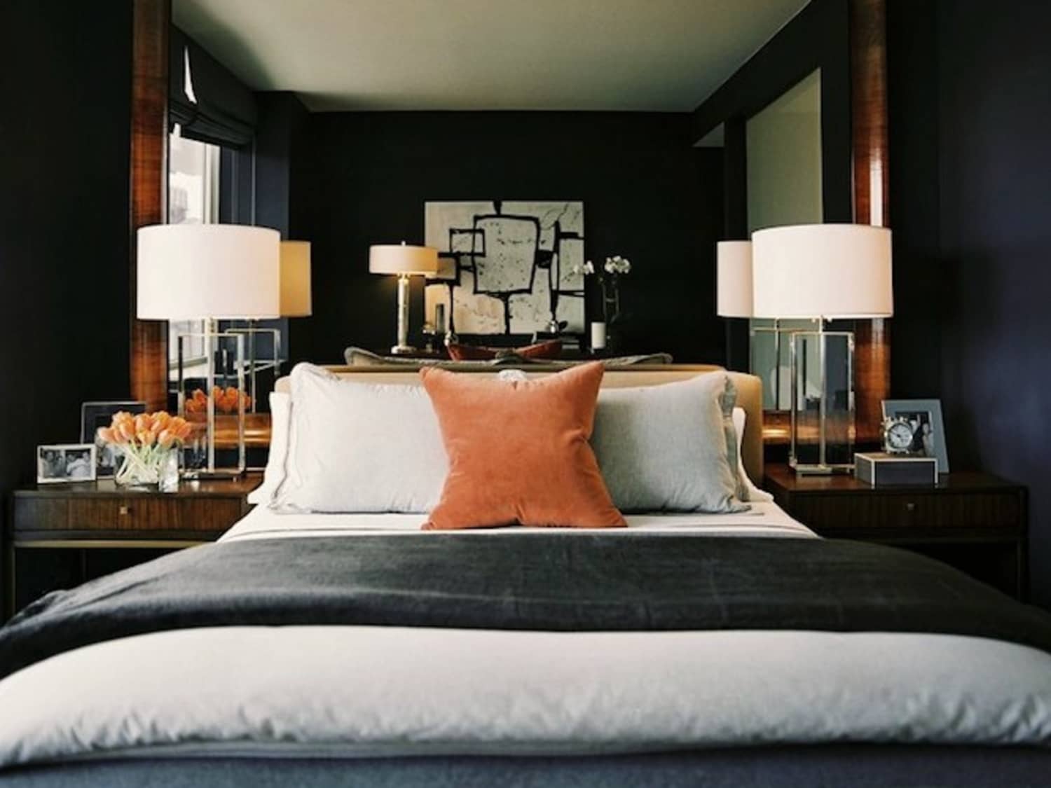Mirror behind lamp on outlet nightstand