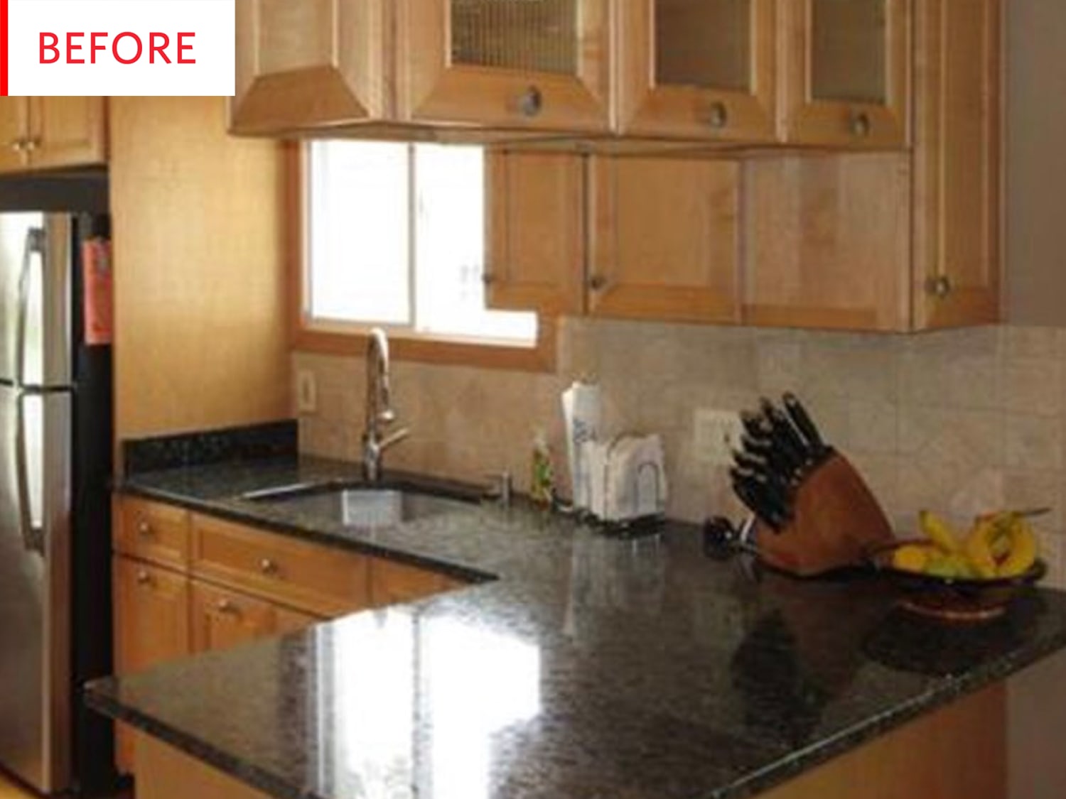 Natural wood cabinets online with black countertops