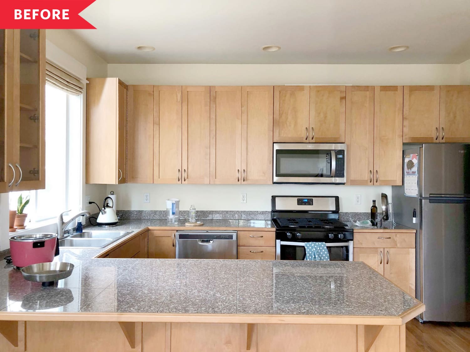 Light wood kitchen cabinets shop with black countertops